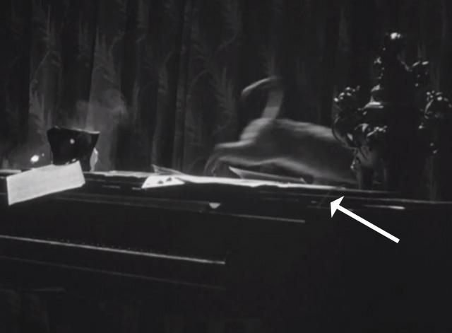 The House of Fear - tabby cat running away from breaking vase of flowers on piano