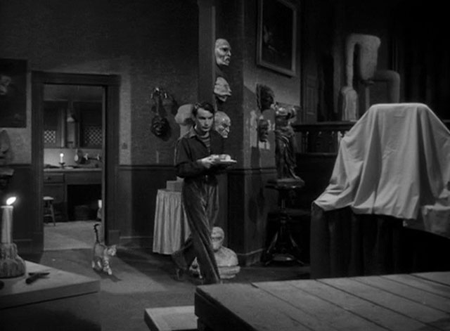 House of Horrors - Marcel Martin Kosleck walking with tray and followed by grey tabby cat Pietro