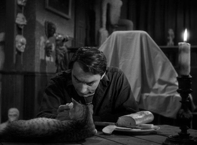 House of Horrors - Marcel Martin Kosleck offering grey tabby cat Pietro some cheese