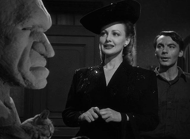 House of Horrors - Marcel Martin Kosleck with Joan Virginia Grey looking at bust as grey tabby cat Pietro preens