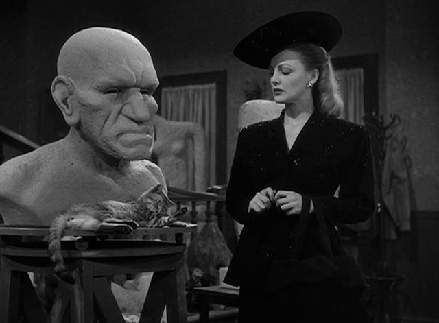 House of Horrors - Joan Virginia Grey looking at bust as grey tabby cat Pietro preens