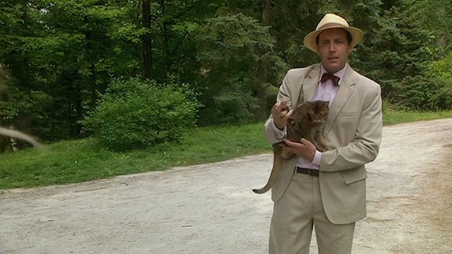 The House Sitter - Frank Jonathan Higgins holding Abyssinian cat Fred Sushi