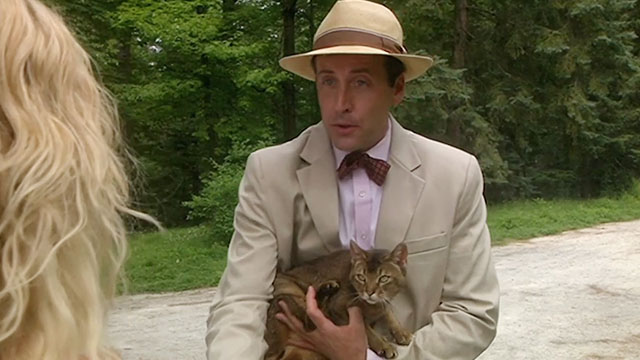 The House Sitter - Frank Jonathan Higgins holding Abyssinian cat Fred Sushi