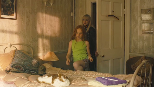 How I Live Now - Piper Harley Bird and Daisy Saoirse Ronan entering room with orange and white cat on bed