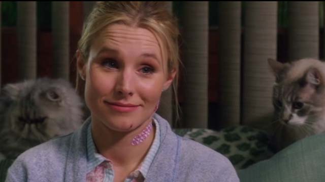 How to Be a Latin Lover - Cindy Kristen Bell with two cats on couch closer