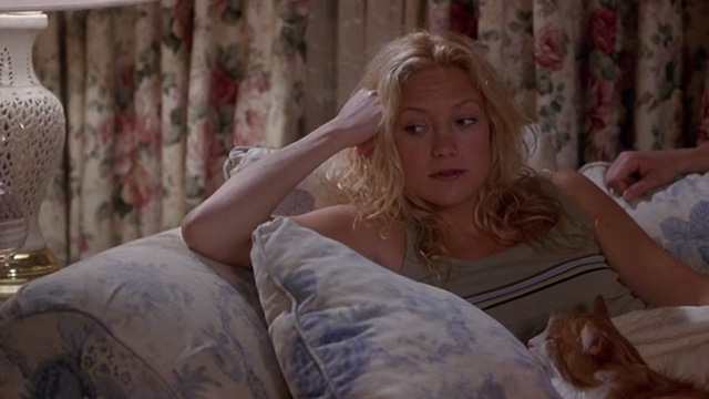 How to Lose a Guy in 10 Days - Andie Kate Hudson looking sad orange and white long haired cat on couch