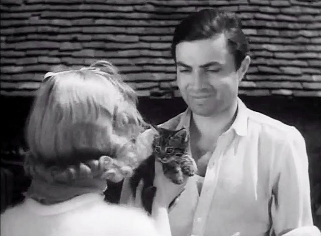 I Met a Murderer - camper Esma Cannon holding tabby kitten up to Warrow James Mason