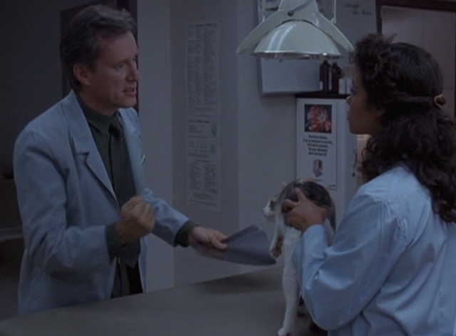 Immediate Family - Michael James Woods with assistant and calico cat in veterinarian's clinic