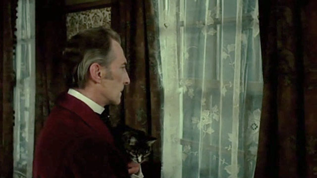 I, Monster - Utterson Peter Cushing holding tabby cat Small Cat while looking out window