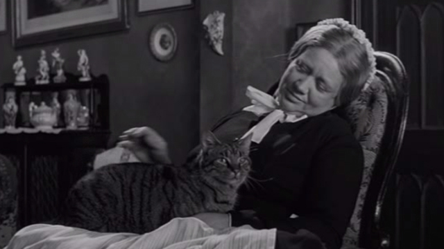 The Innocents - grey tabby cat in the lap of maid Mrs. Grose Meg Jenkins