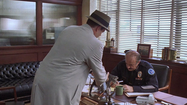 Inspector Gadget - Inspector Gadget Matthew Broderick carrying tabby kitten from Gadgetmobile