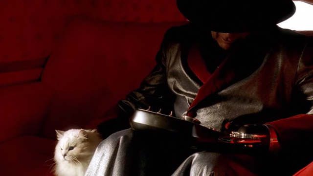 Inspector Gadget 2 - longhaired white cat sitting beside Claw in car