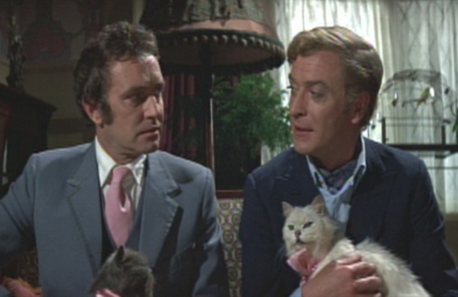 The Italian Job - Charlie and Freddie holding cats in their laps