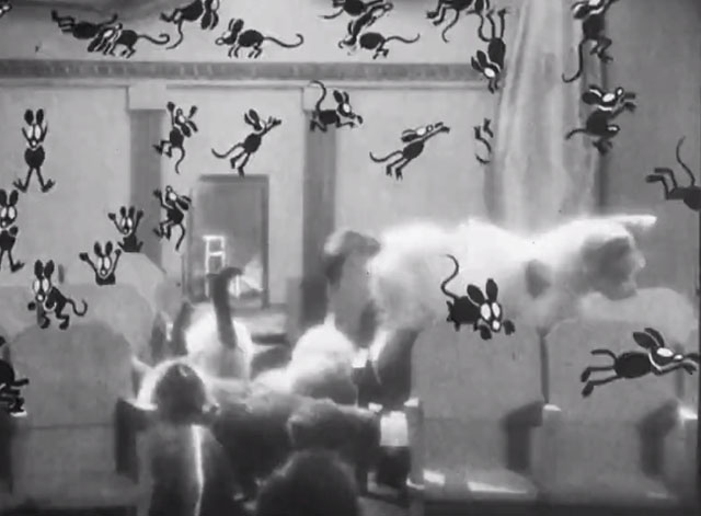 It's the Cats - kittens chasing cartoon mice in audience of theater