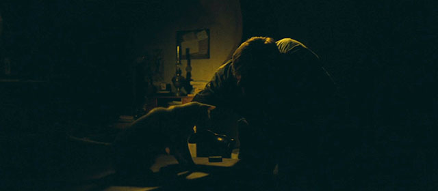 Jean de Florette - Jean Cadoret Gérard Depardieu petting small white cat sitting on table in dark