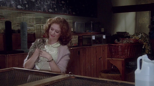 Jennifer - Lisa Pelikan holding brown tabby kitten in pet shop