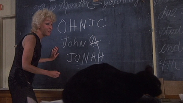 Jinxed! - black cat Angus sitting in school house with Bonita Bette Midler