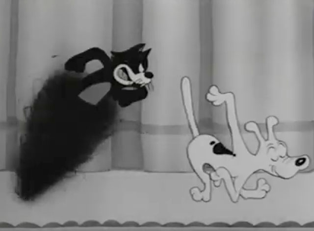 Jitterbug Follies - cartoon black cat emerging from whirlwind to grab J.R. the Wonder Dog