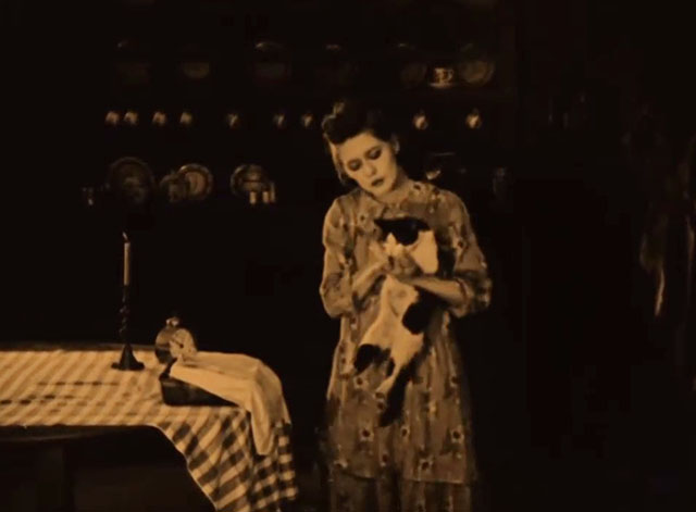 Johanna Enlists - Mary Pickford picking up tuxedo cat from table