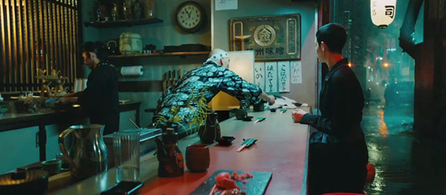 John Wick 3 Parabellum - tuxedo cat lying on counter of sushi restaurant being fed by Zero Mark Dacascos and The Adjudicator Asia Kate Dillon