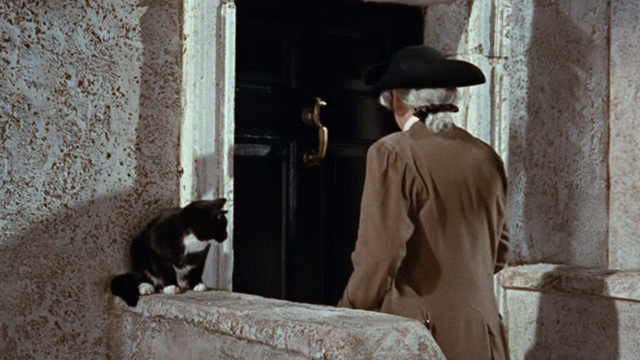 Kidnapped - lawyer Mr. Rankeillor Miles Malleson walking towards office with tuxedo cat outside