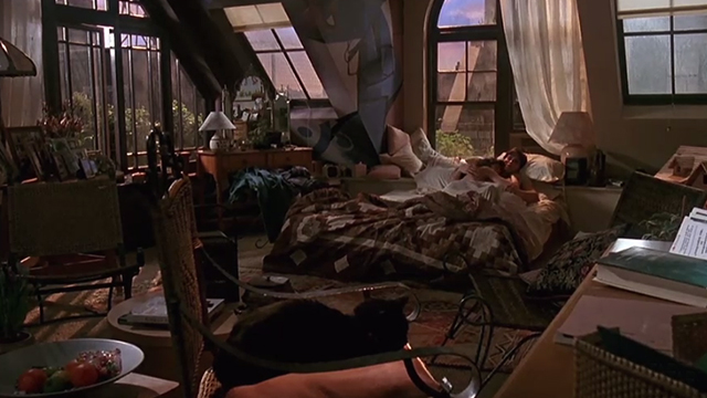 A Kiss Before Dying - black cat Pepe on chair in foreground with Ellen Sean Young and Jay Matt Dillon in bed