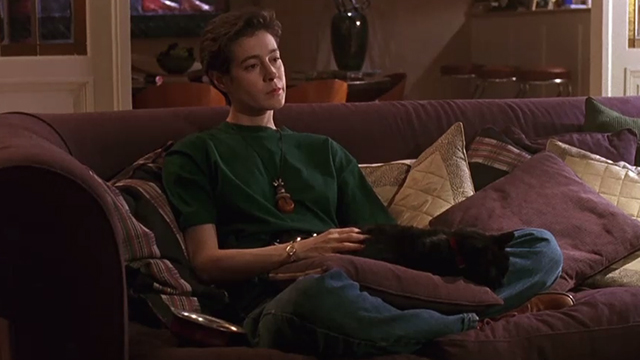 A Kiss Before Dying - black cat Pepe on couch in lap of Ellen Sean Young