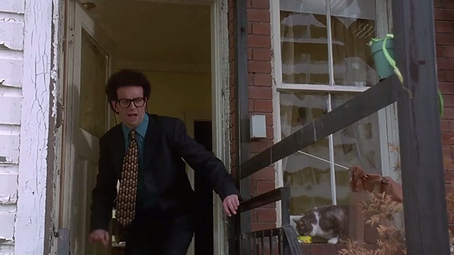 Kids in the Hall Brain candy - Dr. Cooper Kevin McDonald running outside with grey tuxedo cat on windowsill