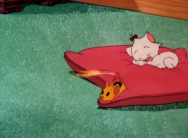 Kitty Cornered - white cartoon kitten Kitty Kuddles the III sleeping on pillow as gunpowder filled mouse toy rolls away
