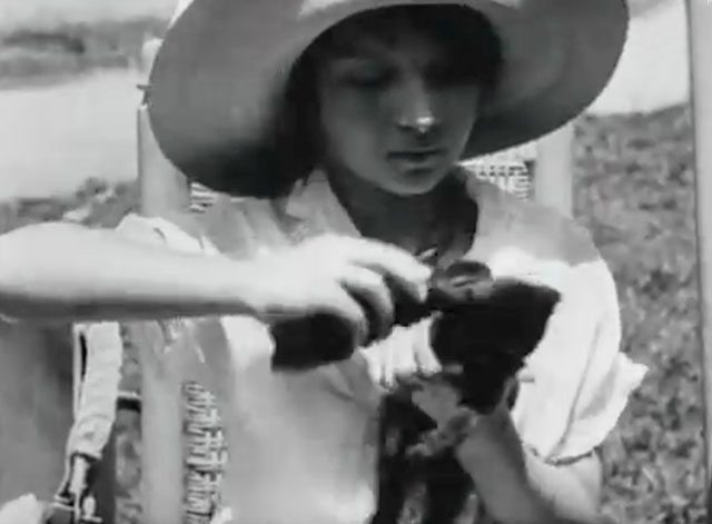 Kitty Kapers - little girl brushing kitten