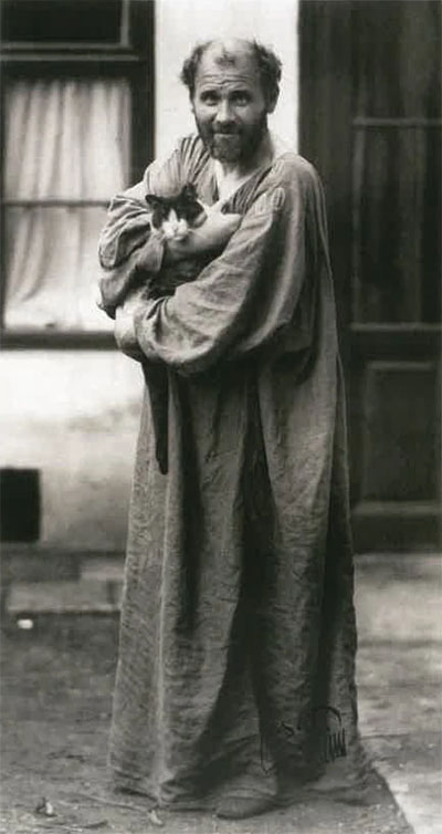 Klimt - artist Gustav Klimt outside studio with tabby and white cat Katze