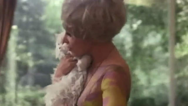 The Landlord - Joyce Enders Lee Grant carrying long-haired white cat