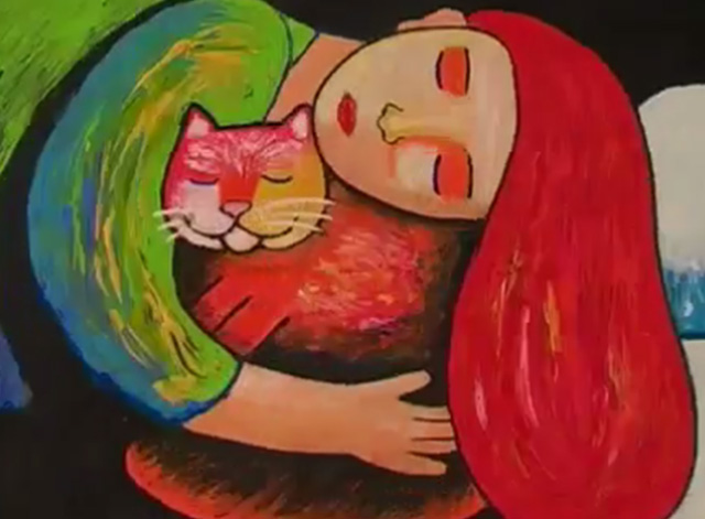 L'anima mavi - orange cat curled up with woman