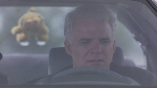 L.A. Story - Harris Steve Martin in car with Garfield toy stuck on back window