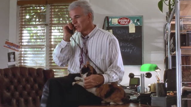 L.A. Story - calico cat being petted by Harris Steve Martin while on phone