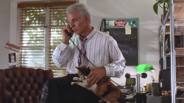 L.A. Story - calico cat being petted by Harris Steve Martin while on phone
