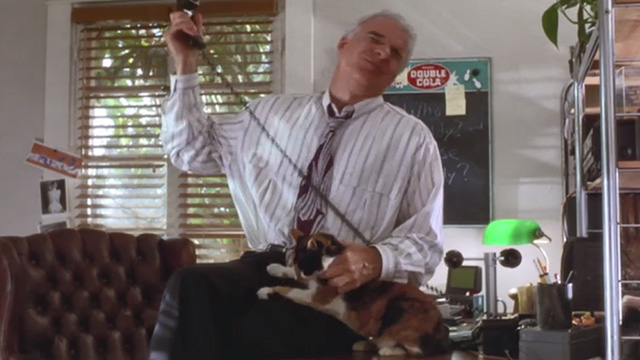 L.A. Story - calico cat being petted by Harris Steve Martin while on phone