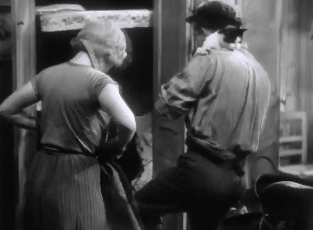 L'Atalante - Jean holding black and white cat on shoulder with Juliette