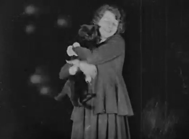 The Late Miss Billie Carleton - longhair black cat being held by Billie Carleton