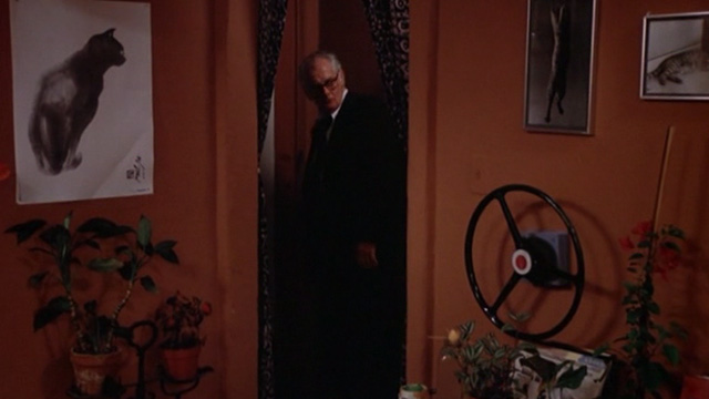 The Late Show - Ira Art Carney in apartment with cat paintings and photos on walls