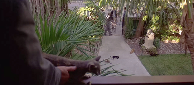 License to Kill - James Bond Timothy Dalton entering Hemmingway House with cats