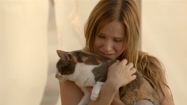 The Lifeguard - Leigh Kristin Bell hugging calico cat Moose