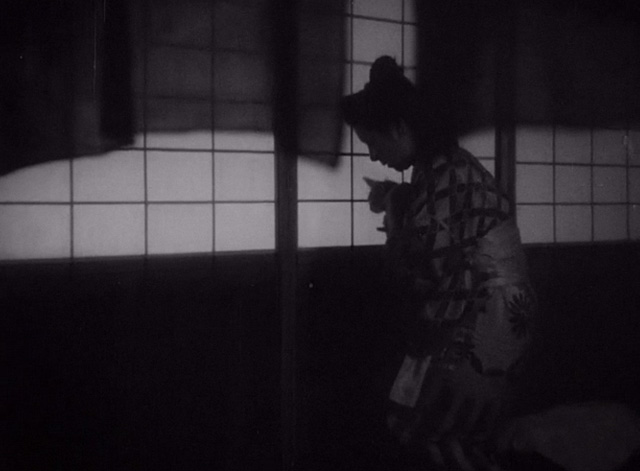 The Life of Oharu - Oharu Kinuyo Tanaka with small cat outside shoji door