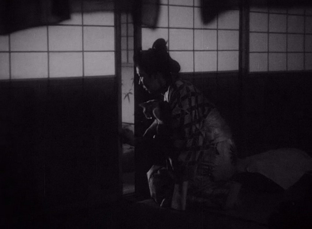 The Life of Oharu - Oharu Kinuyo Tanaka with small cat outside shoji door