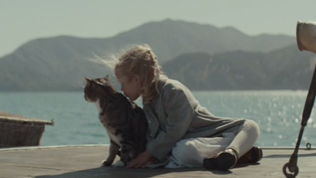 The Light Between Oceans - Lucy Florence Clery kissing tabby cat on boat