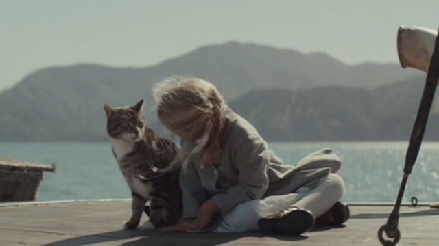 The Light Between Oceans - Lucy Florence Clery sitting beside tabby cat on boat