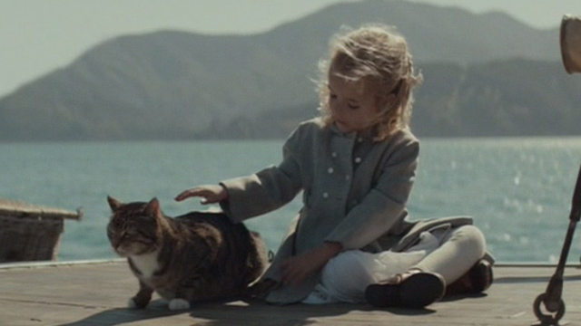 The Light Between Oceans - Lucy Florence Clery petting tabby cat on boat