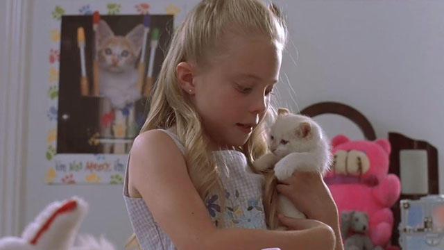Little Secrets - Lea Danielle Chuchran hugging white kitten Dixie