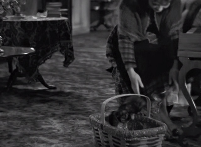 Little Women - Beth Jean Parker reaching down to kittens in basket