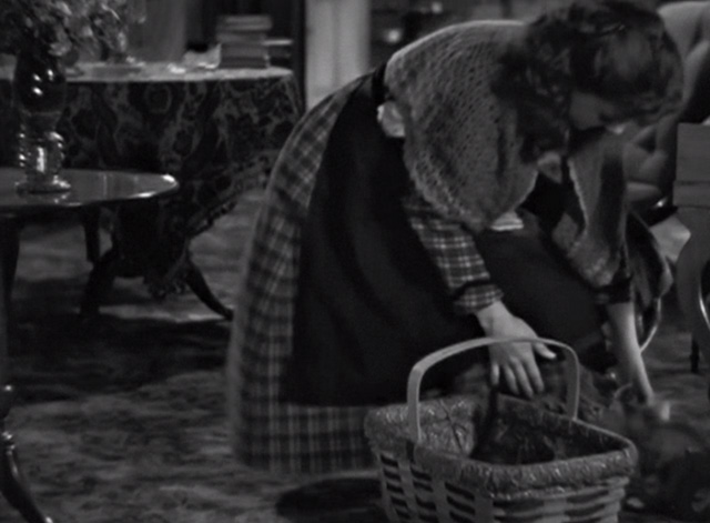 Little Women - Beth Jean Parker reaching down to put kittens back into basket